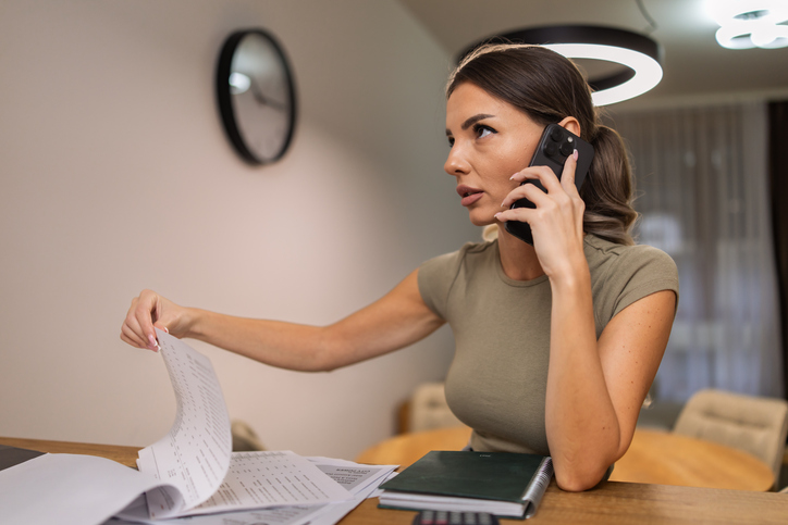 Woman looking concerned over contract