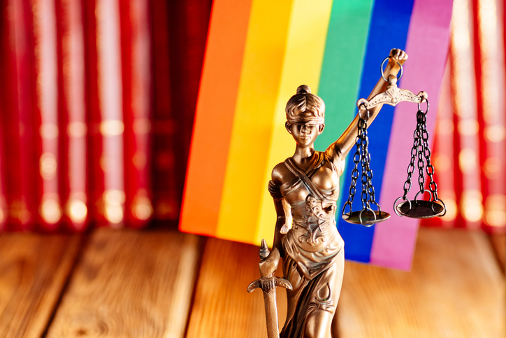 Statue of Justice - symbol of law and justice with lgbt flag